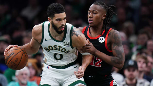 Boston Celtics forward Jayson Tatum and Bulls guard Ayo Dosunmu.